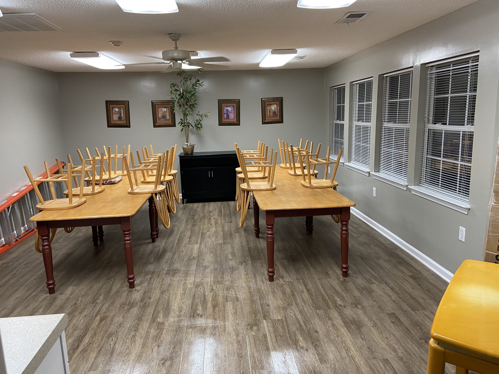 Commercial dining room reset after a Hinsley Cleaning Group visit, chairs up on clean floors